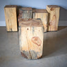 Various sized log side tables cubed for a natural and modern esthetic. All natural. Made from locally harvested logs.